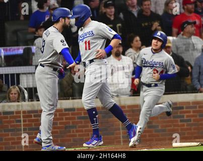 Atlanta, United States. 16th Oct, 2021. Los Angeles Dodgers left fielder AJ Pollock (11) celebrates with teammate Steven Souza, Jr. (L) after scoring from second base on a single by teammate Chris Taylor during the second inning in game one of the MLB NLCS at Truist Park on October 16, 2021 in Atlanta, Georgia. Photo by David Tulis/UPI Credit: UPI/Alamy Live News Stock Photo