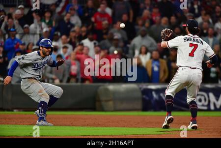 Atlanta, United States. 16th Oct, 2021. Los Angeles Dodgers center fielder Chris Taylor (L) is caught in a run down by Atlanta Braves shortstop Dansby Swanson (7) during the ninth inning in game one of the MLB NLCS at Truist Park on October 16, 2021, in Atlanta, Georgia. Atlanta beat Los Angeles 3-2 to take a 1-0 series lead. Photo by David Tulis/UPI Credit: UPI/Alamy Live News Stock Photo