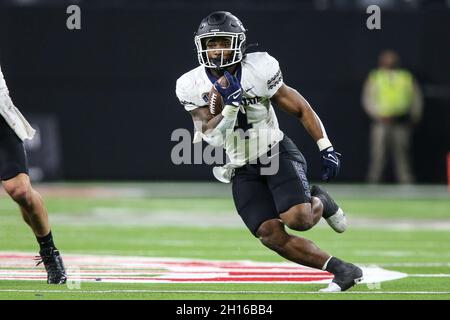 October 16, 2021: Utah State Aggies running back Calvin Tyler Jr. (4) runs with the football during the NCAA football game featuring the Utah State Aggies and the UNLV Rebels at Allegiant Stadium in Las Vegas, NV. The Utah State Aggies defeated the UNLV Rebels 28 to 24. Christopher Trim/CSM. Stock Photo