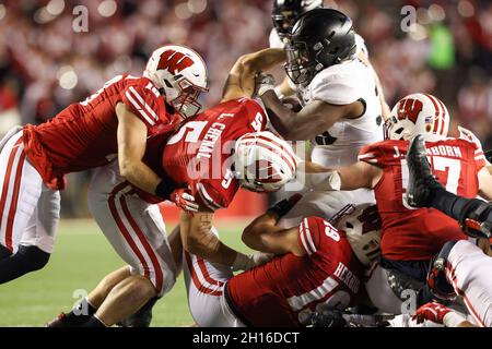 Madison, WI, USA. 13th Nov, 2021. Wisconsin Badgers linebacker Leo Chenal  (5) and linebacker Jack Sanborn (57) watching warm ups before the NCAA  Football game between the Northwestern Wildcats and the Wisconsin