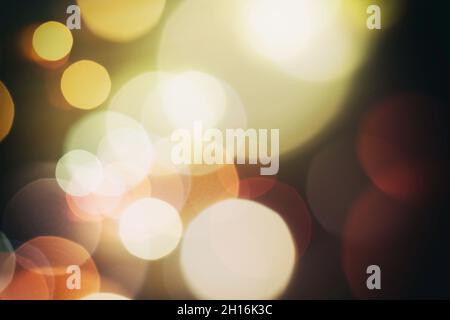 Holiday Christmas glowing color lights with sparkles, blurred bright Christmas abstract bokeh Stock Photo