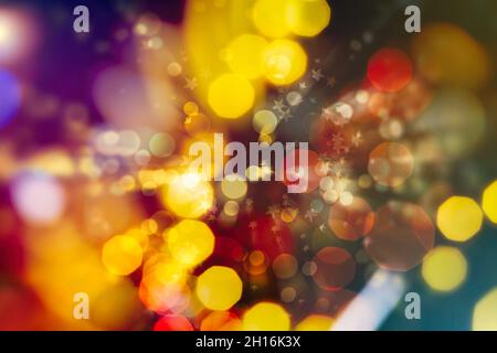 Holiday Christmas glowing color lights with sparkles, blurred bright Christmas abstract bokeh Stock Photo