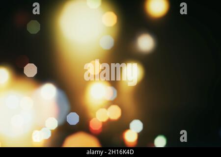 Abstract light celebration background with defocused golden lights for Christmas, New Year, Holiday, party Stock Photo