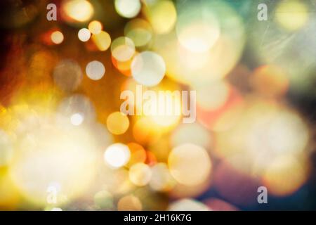 Holiday glowing backdrop. Festive Christmas background. Elegant abstract background with bokeh defocused lights and stars Stock Photo