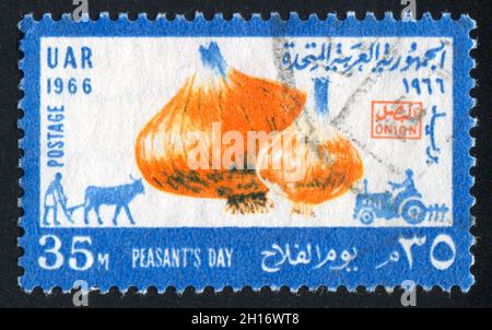 EGYPT - CIRCA 1966: stamp printed by Egypt, shows Onion, plougher, tractor, circa 1966 Stock Photo