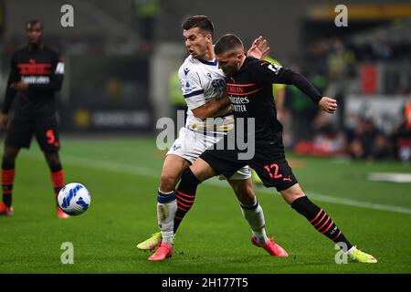 Ante Rebic (Milan)Nicolo Casale (Hellas Verona) during the Italian 'Serie A' match between Milan 3-2 Hellas Verona at Giuseppe Meazza Stadium on October 16, 2021 in Milan, Italy. Credit: Maurizio Borsari/AFLO/Alamy Live News Stock Photo