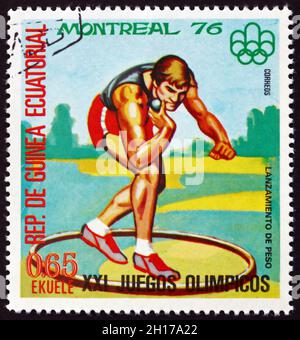 EQUATORIAL GUINEA - CIRCA 1978: a stamp printed in Equatorial Guinea shows Shot Put, Summer Olympics 1976, Montreal, circa 1978 Stock Photo