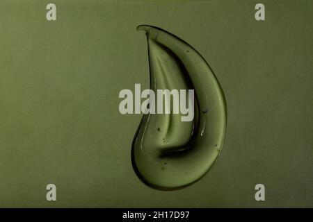 Liquid cream gel cosmetic smudge texture mint green background