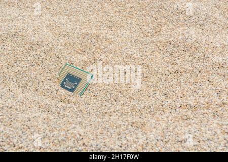 Ancient computer CPUs buried in a sandy heap for computer graveyard ...