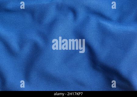 Texture of blue crumpled fabric with waves. Stock Photo