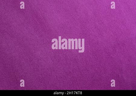 Surface texture of pink suede leather close-up. Stock Photo