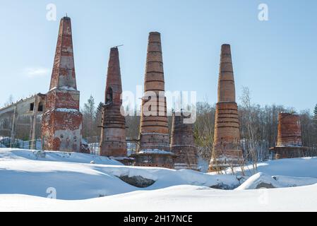 View of the ruins of the lime kilns of the old marble and lime factory on a sunny March day. Ruskeala, Karelia Stock Photo