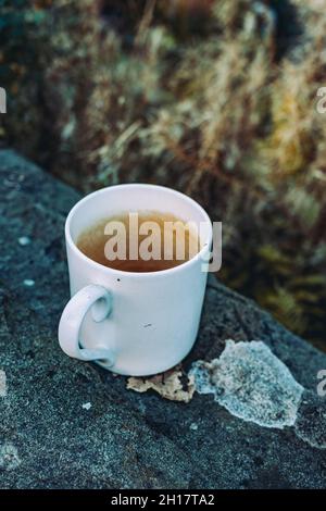 Empty white mug left on a wall Stock Photo
