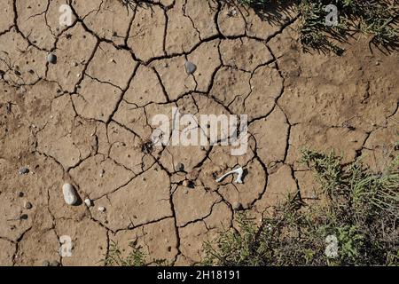 Cracked clay ground at the dry season. Dry soil texture wallpaper 4k Stock Photo