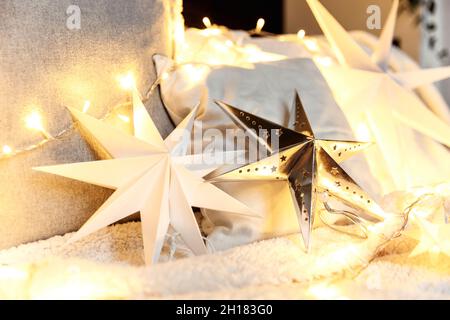 Christmas mood or New Year happy time decorations, silver paper star shape  Stock Photo