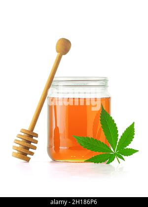 Medical Marijuana or Hemp Infused Natural Honey with Cannabis Leaf Isolated on White Background Stock Photo