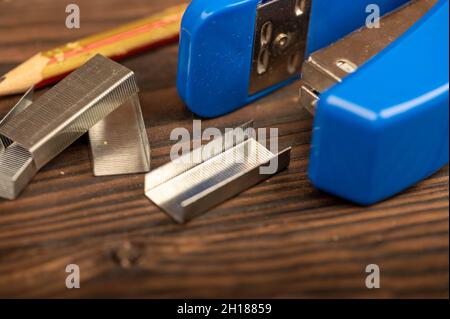 Stationery stapler, stapler staples, close-up selective focus Stock Photo