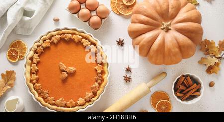 Thanksgiving American Pumpkin Pie. Cooking concept on white background. View from above. Flat lay. Stock Photo