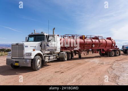 An acid tanker carrying acid for acidizing an oil well to restore production.  Utah. Stock Photo