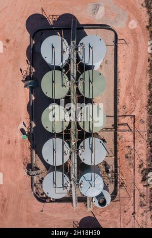 An aerial view of an storage tank battery on an oil well location in the canyon country of Utah. Stock Photo