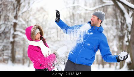 happy friends playing snowball in winter forest Stock Photo - Alamy