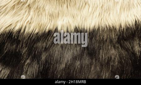 Detail of a two-colour black and cream fake fur. Stock Photo