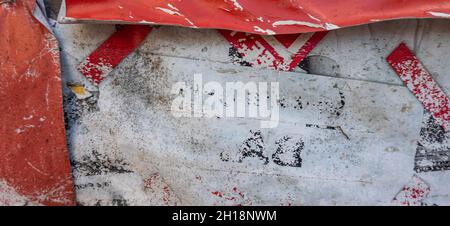 Old black and yellow grunge ripped torn collage posters creased crumpled paper placard texture background Stock Photo