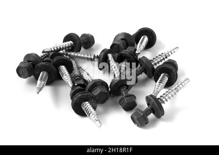 Metal roofing screws. Black screws on metal isolated on white background Stock Photo