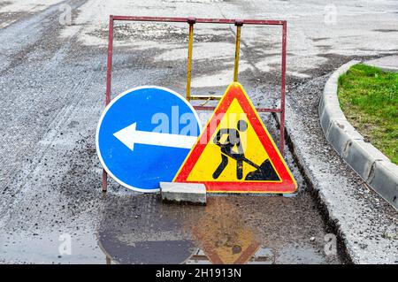 warning sign and stop at road construction Stock Photo - Alamy