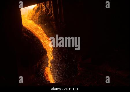 Discharge of liquid metal from a metallurgical furnace Stock Photo