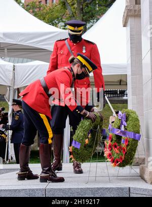 Halifax, Nova Scotia, Canada. October 17th, 2021. RCMP officers, lay a wreath on behalf of their troop in honour of Nova Scotia Peace Officers who died in line of duty. This marks the 39th annual Peace Officers' Memorial, held at the Grand Parade in downtown Halifax. The event honours peace officers based in Nova Scotia who died in the line of duty and is a humbling reminder of their selflessness and dedication. Credit: meanderingemu/Alamy Live News Stock Photo