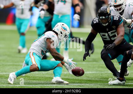 London, UK. 17th October 2021; Tottenham Hotspur stadium, London, England; NFL UK Series, Miami Dolphins versus Jacksonville Jaguars; Miami Dolphins Running Back Myles Gaskin (37) fumbles the ball Credit: Action Plus Sports Images/Alamy Live News Stock Photo