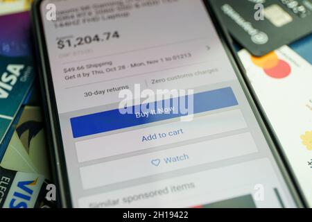 Buy now button on screen. Buying items online on amazon or ebay Stock Photo
