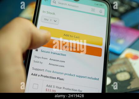 Buy now button on screen. Buying items online on amazon or ebay Stock Photo