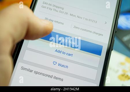 Buy now button on screen. Buying items online on amazon or ebay Stock Photo