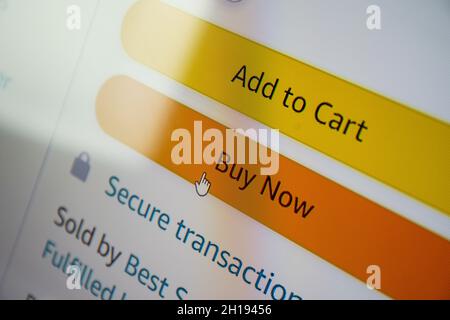 Buy now button on screen. Buying items online on amazon or ebay Stock Photo