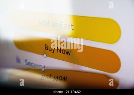 Buy now button on screen. Buying items online on amazon or ebay Stock Photo