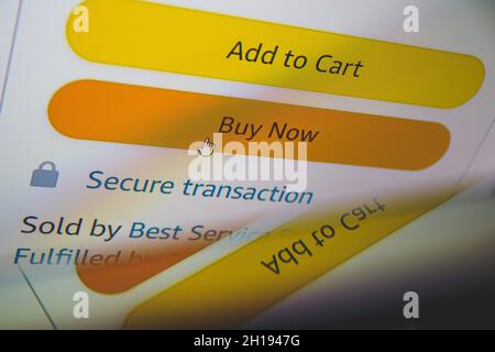 Buy now button on screen. Buying items online on amazon or ebay Stock Photo