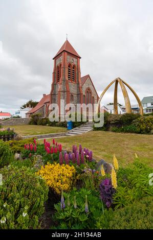 Christ Church Cathedral and the Whalebone Arch in Stanley, the capital of the Falkland Islands. Stanley, Falkland Islands. Stock Photo