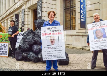 London, UK. 17th Oct, 2021. An activist holds a placard critical of Will Gardiner, the CEO of energy company Drax Group, during the protest outside the Science Museum. Extinction Rebellion activists gathered outside the museum in South Kensington ahead of the Global Investment Summit, taking place on 19th October, in protest against what they say is a 'greenwash platform' for some of the world's top polluters and companies financing fossil fuels. Credit: SOPA Images Limited/Alamy Live News Stock Photo