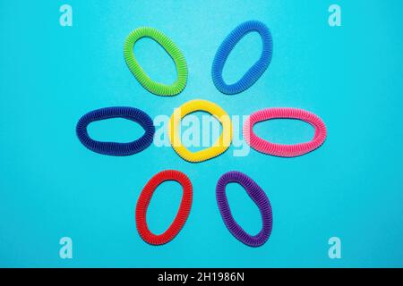 Colorful Elastic Rings On Hand Girl Elastic Fashion Band Hair Scrunchy On  Hand A Scrunchie Is A Fabric Covered Rubber Band Hair Used To Fasten Long  Hair Stock Photo - Download Image