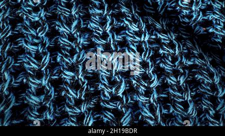 Wool texture, draped textile pattern closeup. Woolen texture fabric background. Visible details in delicate threads, that make up the woven fabric. Stock Photo