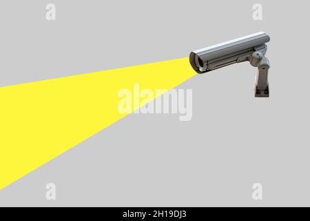 Security camera on gray wall. Minimal creative concept. Stock Photo