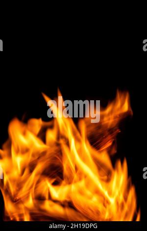 Fire flames isolated on a black backdrop. Abstract fire background. Stock Photo
