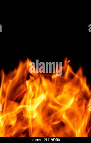 Fire flames isolated on a black backdrop. Abstract fire background. Stock Photo