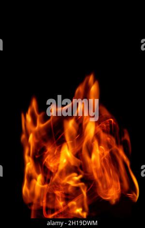Fire flames isolated on a black backdrop. Abstract fire background. Stock Photo