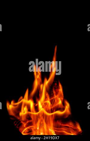 Fire flames isolated on a black backdrop. Abstract fire background. Stock Photo