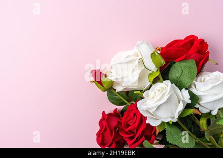 Creative layout made with flowers on pink backdrop. Spring minimal concept. Stock Photo