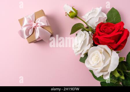 Creative layout made with flowers on pink backdrop. Spring minimal concept. Stock Photo