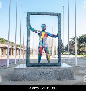 Marc by Robert Llimós This statue portrays a colourful, genderless, neo-expressionist human figure holding a large picture frame. Stock Photo